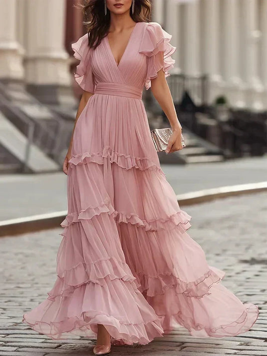 Vestido de boda rosa empolvado con falda de capas